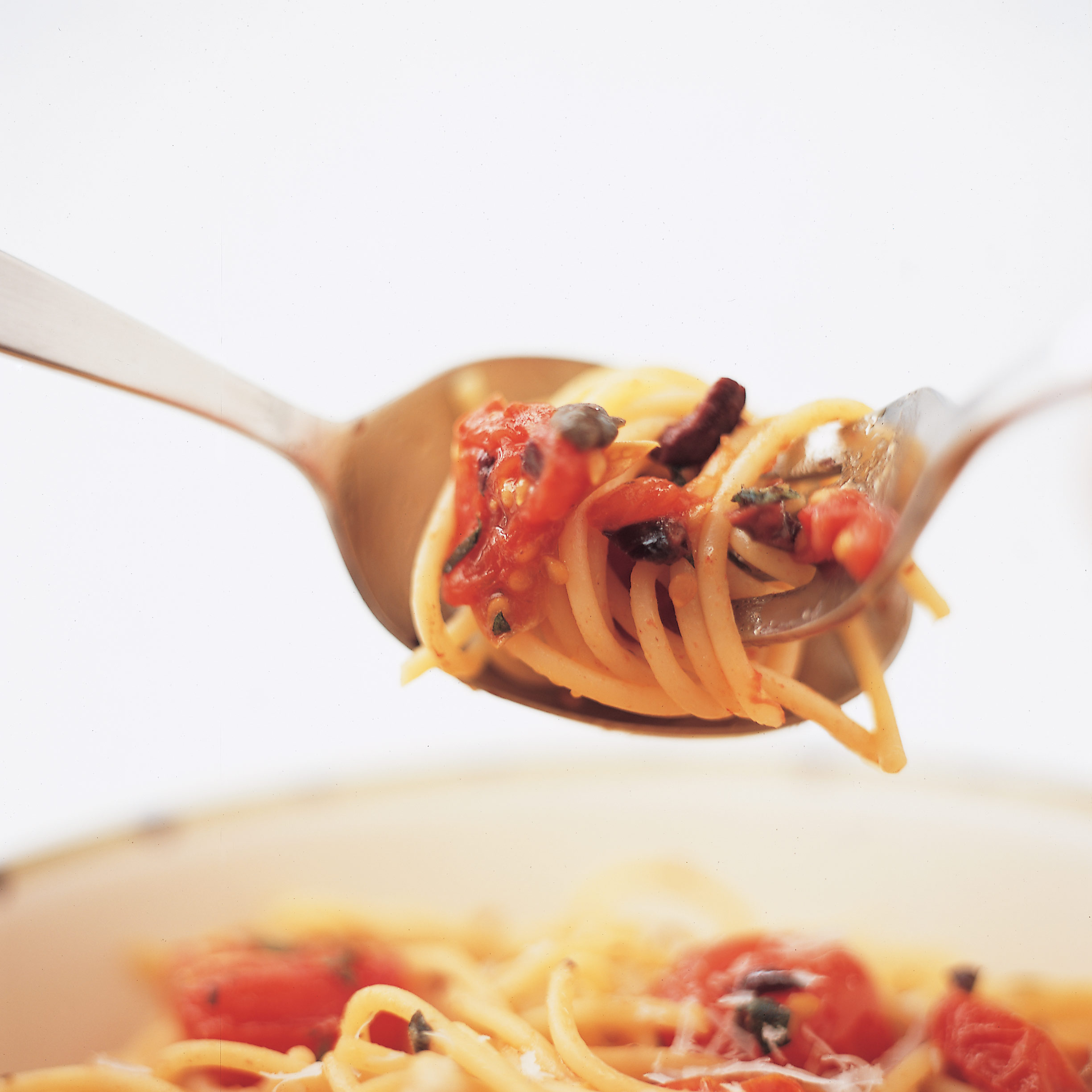 Spaghetti with Cherry Tomatoes, Olives, Capers, and Pine Nuts Recipe