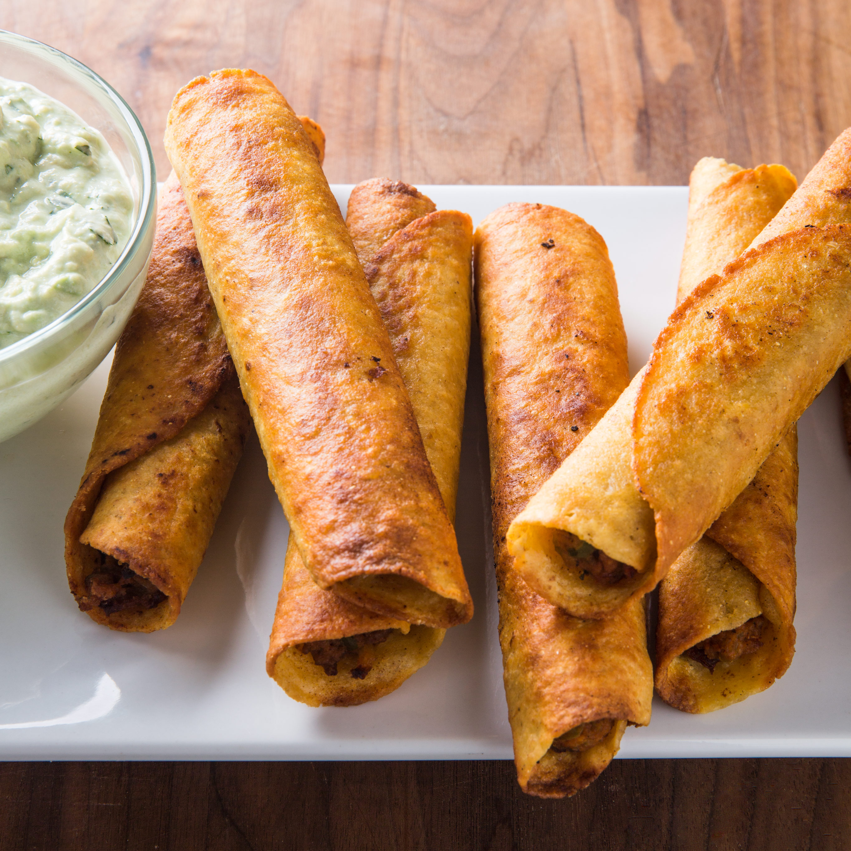 Bean and Beef Taquitos with Avocado Sauce Cook's Country